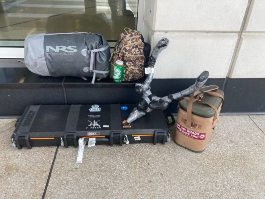 Collection of hunting gear stored outside