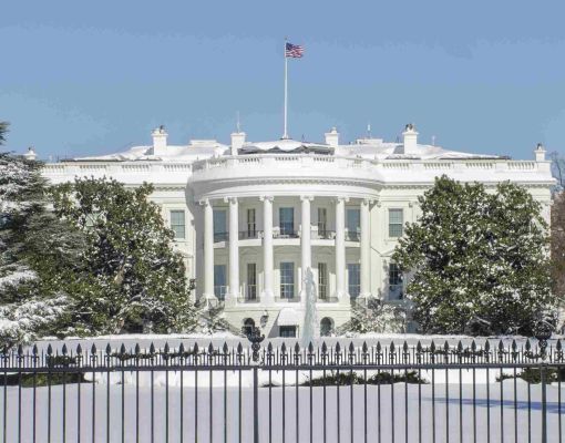 The White House covered in snow during winter.
