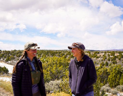 Two women smiling in a conservation planning setting.