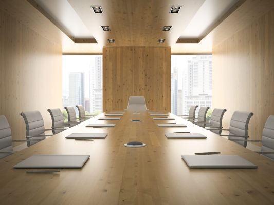 Contemporary conference room with a large table and chairs