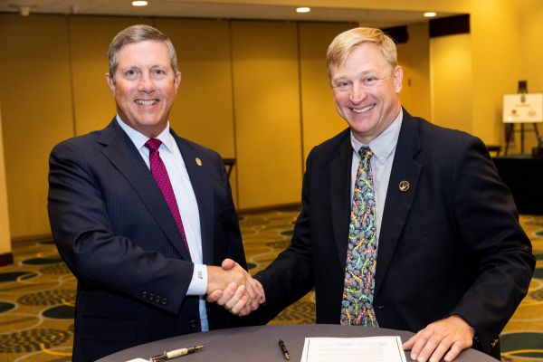 Mule Deer Foundation representatives at a formal signing event.
