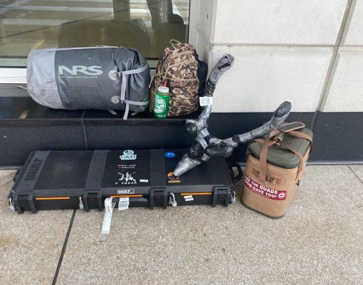 Collection of hunting gear stored outside