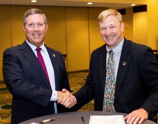 Mule Deer Foundation representatives at a formal signing event.