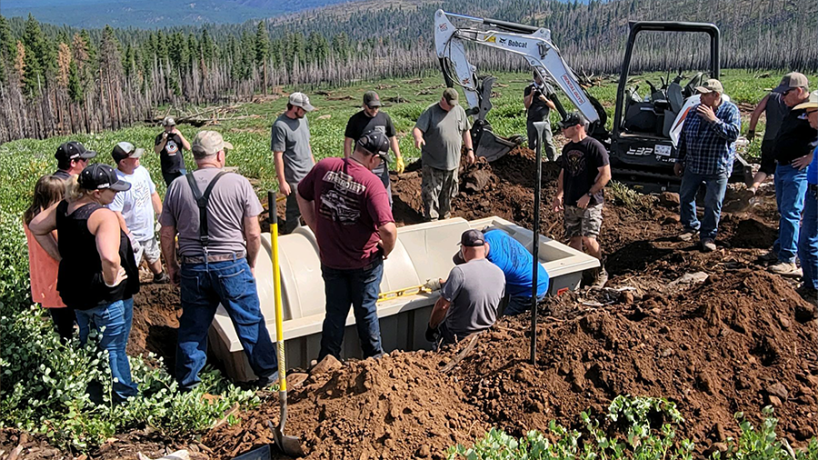 Community volunteers working on pond construction for wildlife habitat.