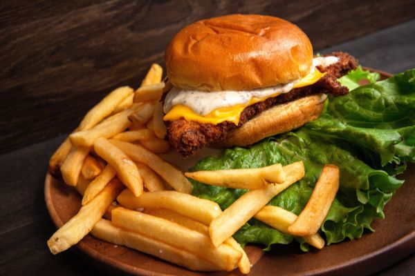 A delicious fried chicken sandwich served with crispy fries.