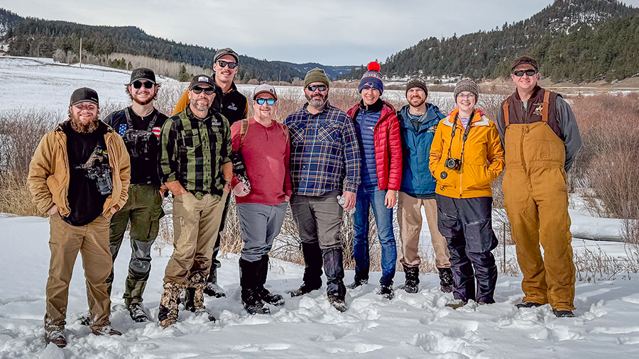 Group of volunteers in winter setting for habitat restoration