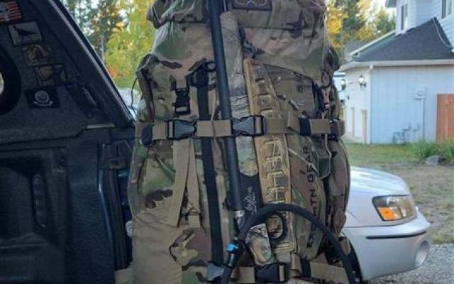 Hunting backpack and water bottle in truck bed