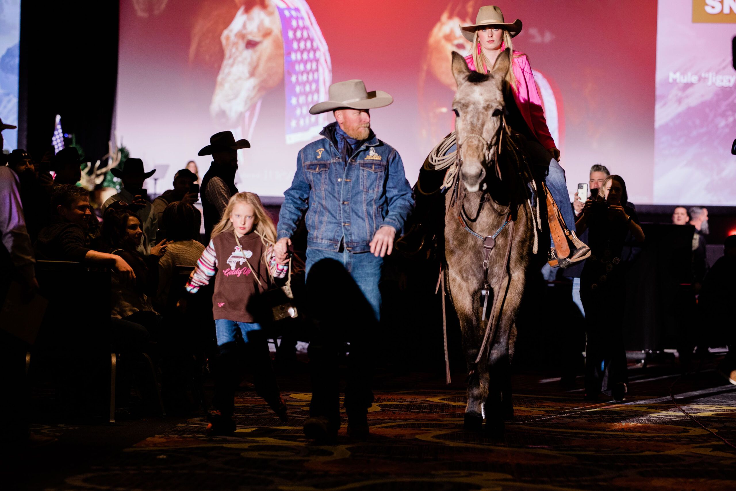 Community event showcasing youth engagement with horses.