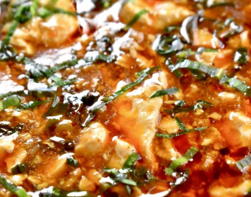 Close-up of a gourmet dish garnished with herbs.