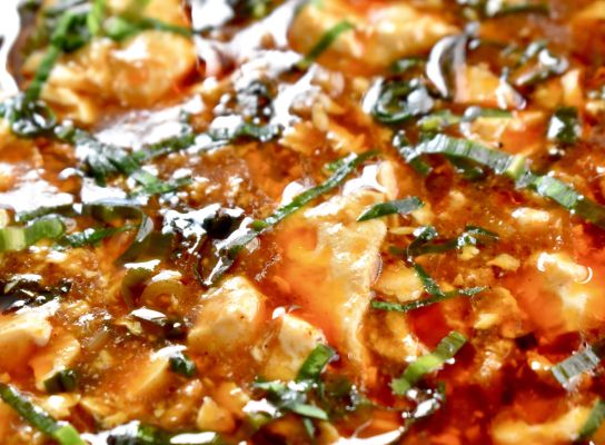 Close-up of a gourmet dish garnished with herbs.