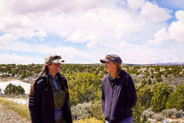 Two women smiling in a conservation planning setting.