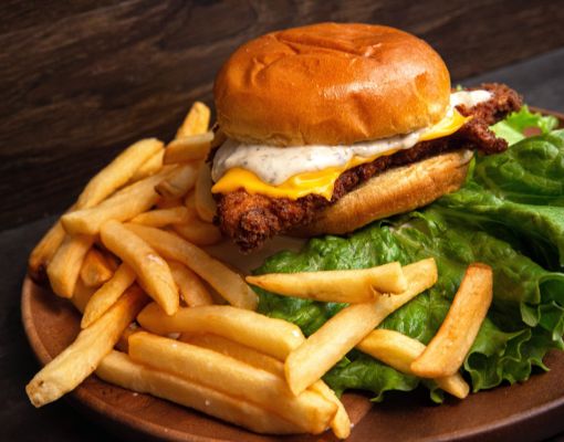 A delicious fried chicken sandwich served with crispy fries.