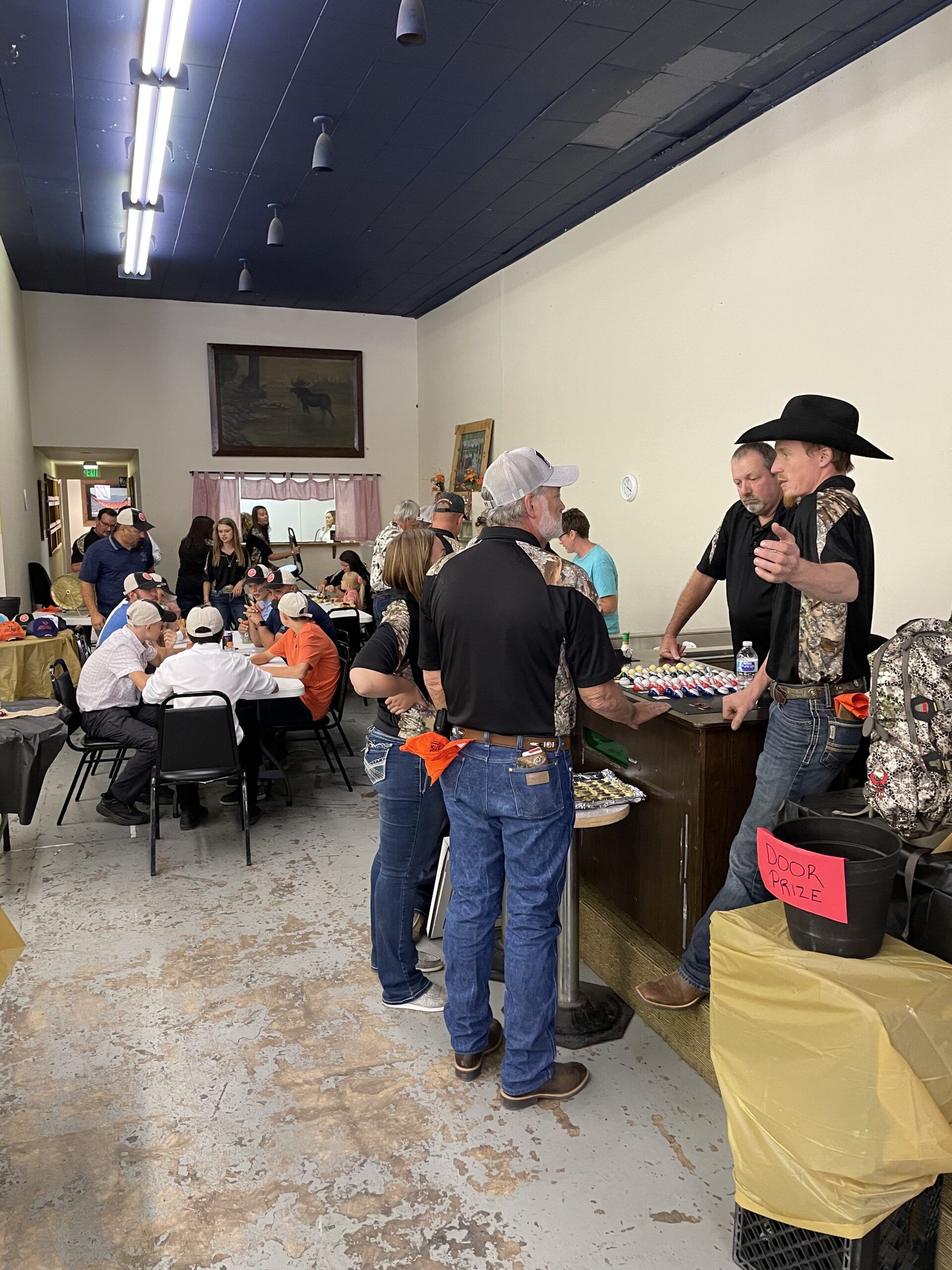 Community gathering at Mule Deer Foundation banquet event with attendees