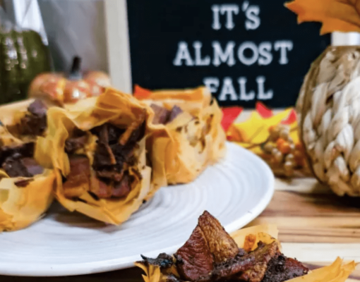 Delicious venison-filled pastry presented with autumn decorations.