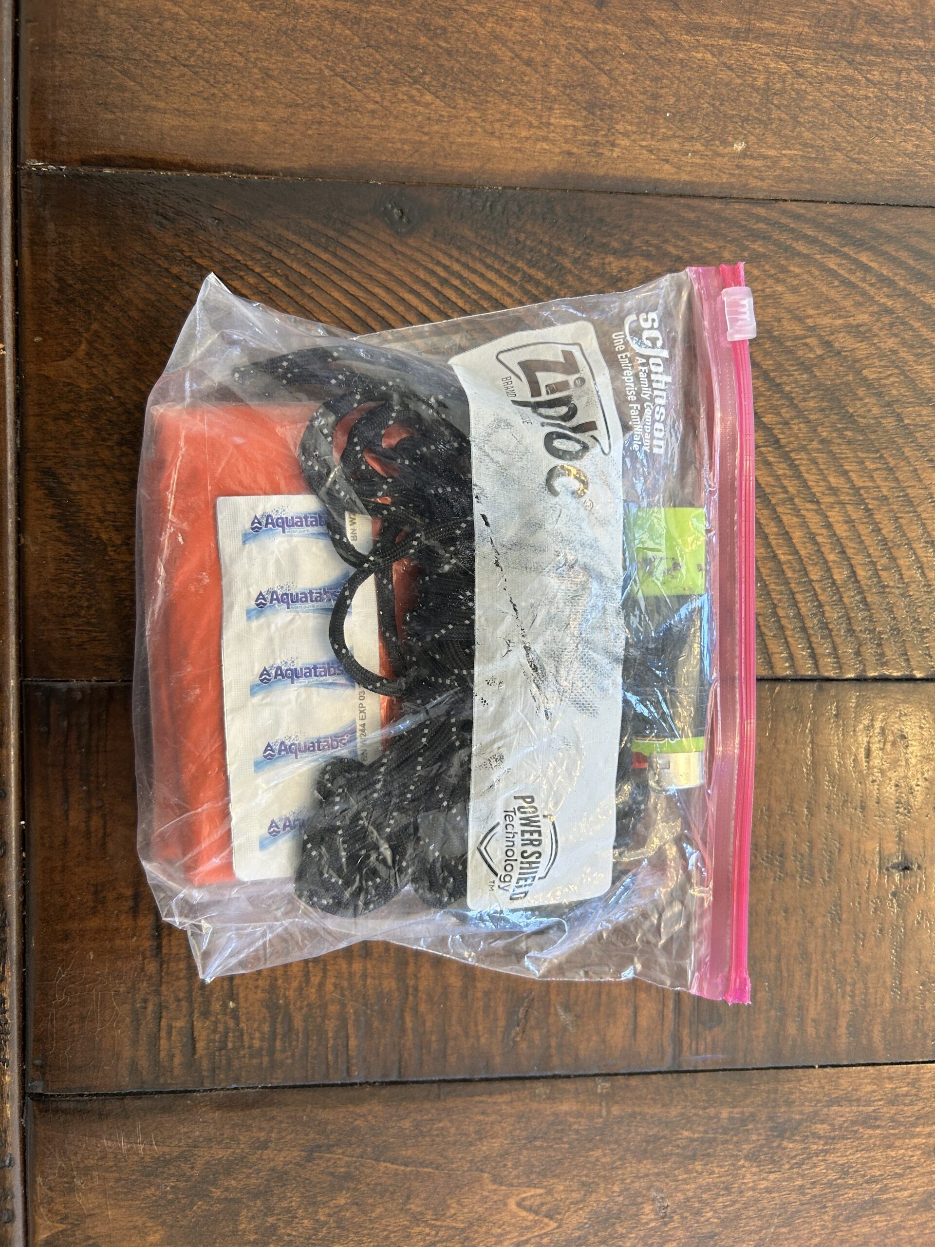 Emergency safety kit in a ziplock bag with supplies.