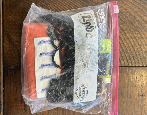 Emergency safety kit in a ziplock bag with supplies.