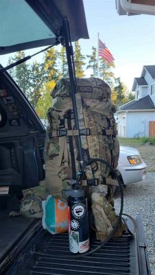 Hunting backpack and water bottle in truck bed