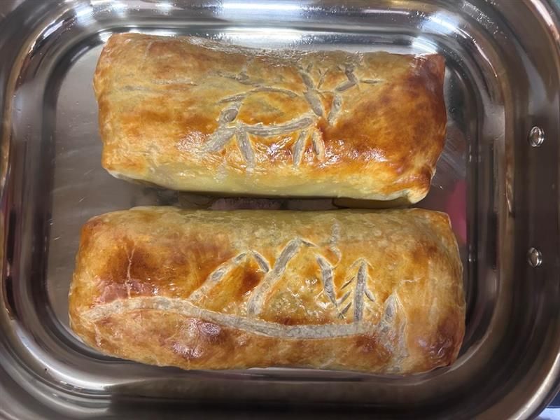 Baked pastries with mule deer and mountain designs