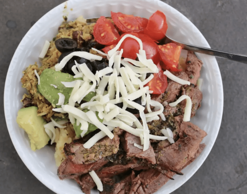 Bowl of food featuring mule deer meat and fresh ingredients.