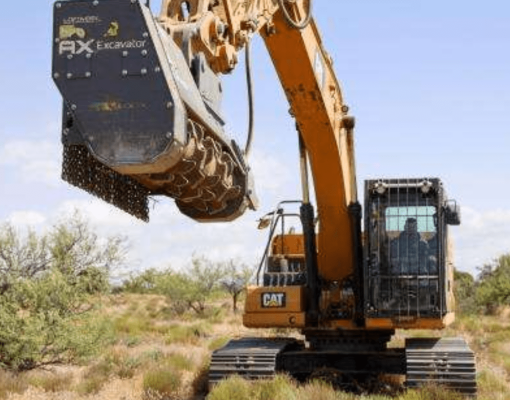 Excavator working in a desert habitat for conservation efforts.