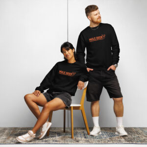 Two individuals modeling Mule Deer Foundation apparel in a studio setting.