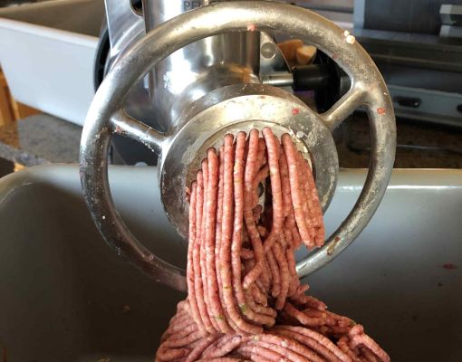 Meat grinder processing ground game meat