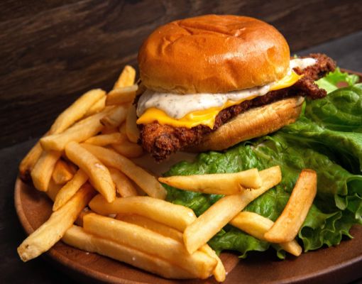 A delicious fried chicken sandwich served with crispy fries.
